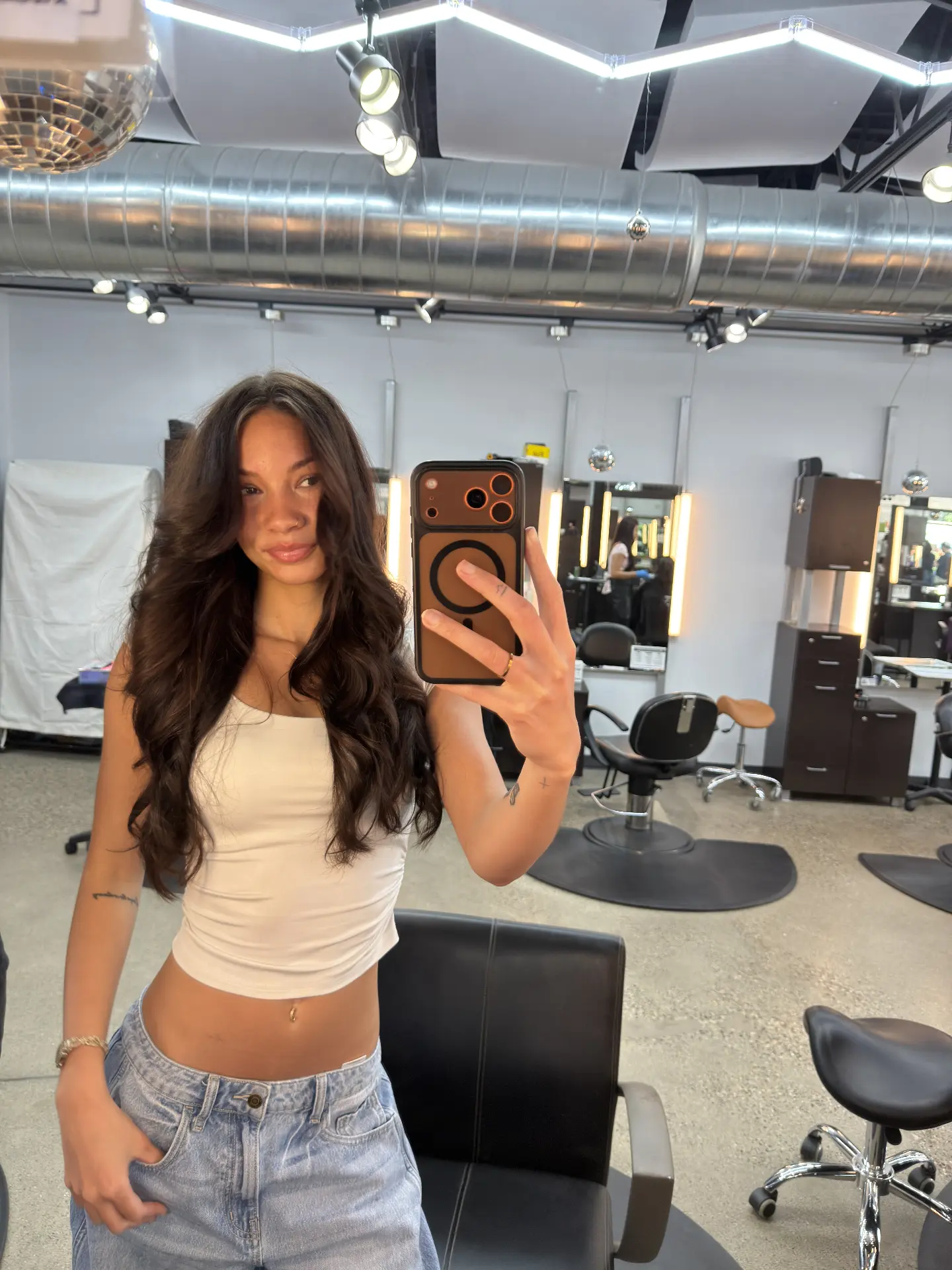 Long dimensional brunette waves styled in salon