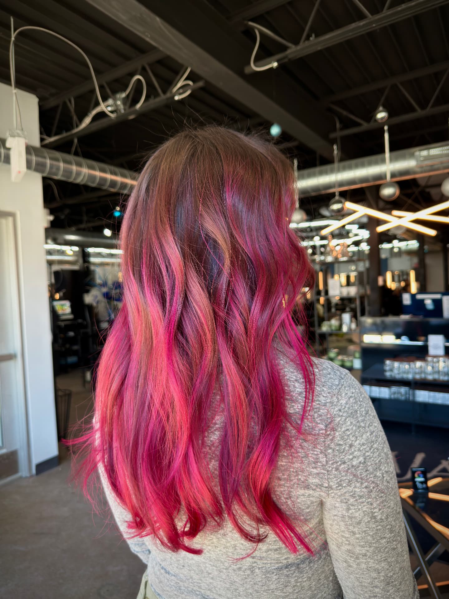 Vivid magenta pink balayage on wavy long hair