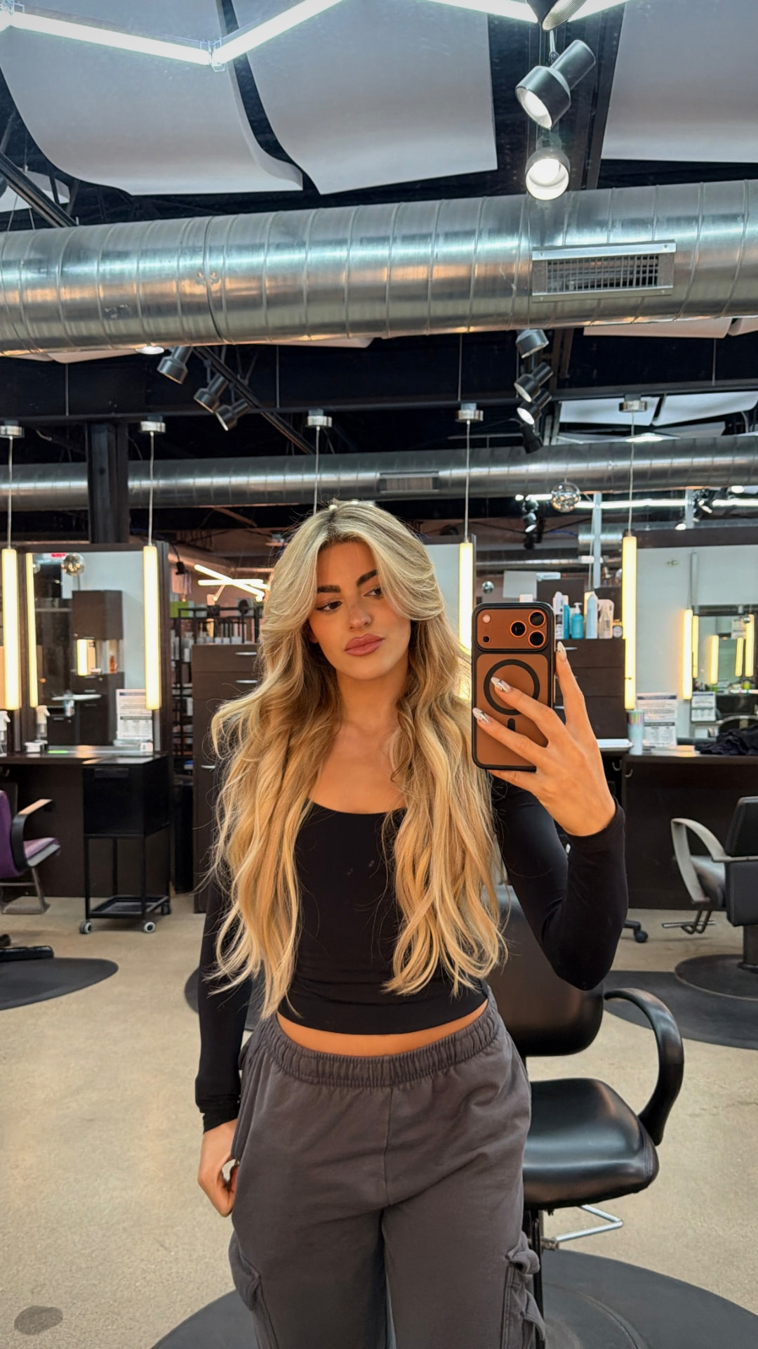 Long buttery blonde balayage with soft waves
