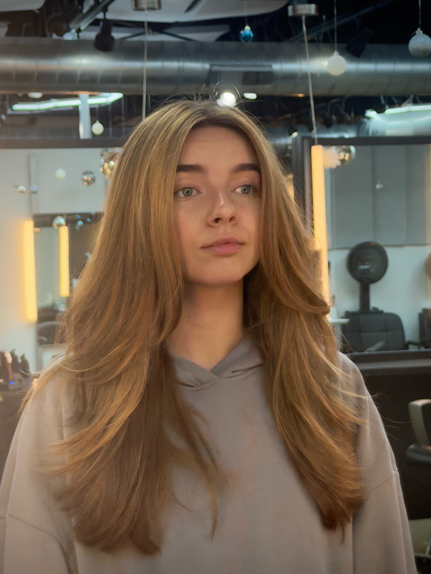 Long layered honey blonde with face-framing layers