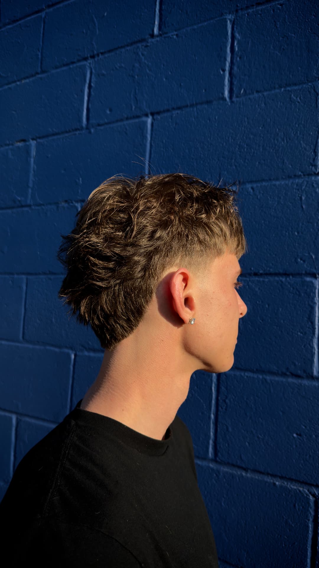 Men's textured mullet with faded sides
